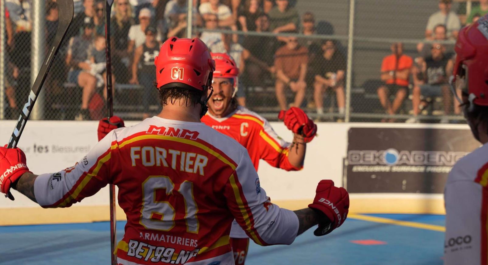 Two Dek Hockey Players in Quebec celebrating